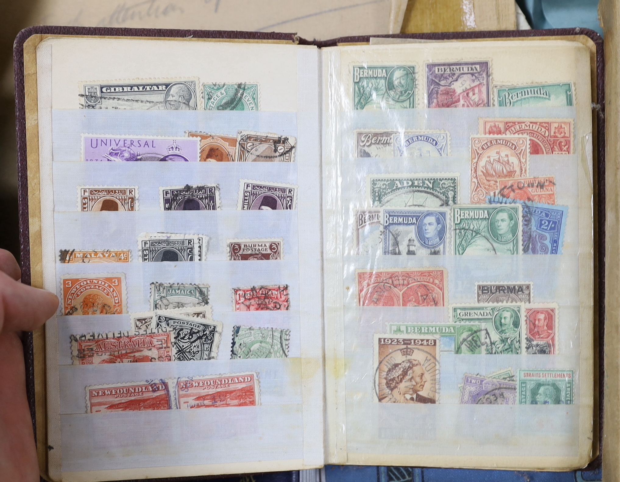 A box of mixed stamp albums
